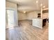 Bright open living space with hardwood floors and access to the back patio, perfect for entertaining at 211 Serendipity Way, Dallas, GA 30157