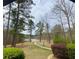 Community path with landscaping offers a scenic route to the lake, inviting residents to explore and unwind at 211 Serendipity Way, Dallas, GA 30157