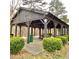 The community pavilion, nestled in green landscaping, offers covered seating and a welcoming space for residents at 211 Serendipity Way, Dallas, GA 30157