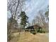 Community pavilion features covered seating, providing a peaceful spot amidst natural surroundings at 211 Serendipity Way, Dallas, GA 30157