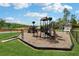 Community playground with climbing structures, slides, and soft ground cover, perfect for active  at 211 Serendipity Way, Dallas, GA 30157