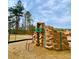 Playground with climbing wall and other equipment providing a safe and engaging area for  at 211 Serendipity Way, Dallas, GA 30157