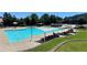 Large community pool with ample seating, splash features, and shaded areas for a fun and relaxing experience at 211 Serendipity Way, Dallas, GA 30157