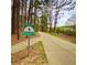 View of the Silver Comet Trail with signage pointing towards the Rambo Trailhead at 211 Serendipity Way, Dallas, GA 30157