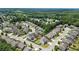 Wide aerial shot capturing the serene neighborhood surrounded by trees and meticulously designed houses at 431 La Perla Dr, Sugar Hill, GA 30518