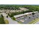 A high aerial view showcasing a commercial area next to a residential neighborhood at 431 La Perla Dr, Sugar Hill, GA 30518
