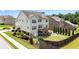 Exterior aerial shot of landscaped backyard with a deck, stone patio, and privacy fence at 431 La Perla Dr, Sugar Hill, GA 30518