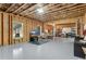 Unfinished basement with exposed beams, framing, and a sealed concrete floor at 431 La Perla Dr, Sugar Hill, GA 30518