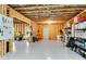 Large unfinished basement with exposed wood framing, utilities, and a sealed concrete floor at 431 La Perla Dr, Sugar Hill, GA 30518