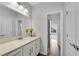 Hall bathroom with cultured marble vanity and tile floors at 431 La Perla Dr, Sugar Hill, GA 30518