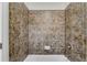 Shower with brown-tiled surround at 431 La Perla Dr, Sugar Hill, GA 30518