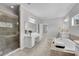 Bright bathroom features double vanities, soaking tub, tiled shower, and neutral tile at 431 La Perla Dr, Sugar Hill, GA 30518