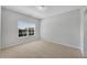 Neutral bedroom with natural light and plush carpeting at 431 La Perla Dr, Sugar Hill, GA 30518
