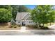 Charming clubhouse with well-kept landscaping providing a welcoming community gathering space at 431 La Perla Dr, Sugar Hill, GA 30518