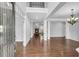 Light and airy foyer leads to living spaces, showcasing hardwood floors and elegant architectural details at 431 La Perla Dr, Sugar Hill, GA 30518
