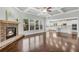 Open concept living room with fireplace, coffered ceiling, and views to the kitchen at 431 La Perla Dr, Sugar Hill, GA 30518