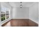 Bright room with hardwood floors and a large window offering lots of natural light at 431 La Perla Dr, Sugar Hill, GA 30518