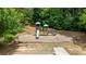 Community playground featuring slides and climbing structures nestled in a shaded, wooded area at 431 La Perla Dr, Sugar Hill, GA 30518
