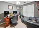 Comfortable bedroom with a desk, large window, and neutral color scheme at 51 Vienna Way, Douglasville, GA 30134