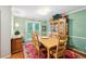 Cozy dining room featuring a wooden table, six chairs, and a decorative hutch at 51 Vienna Way, Douglasville, GA 30134