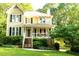 Beautiful home featuring a covered porch and well-maintained landscaping at 51 Vienna Way, Douglasville, GA 30134