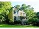 Lovely two-story home with a welcoming front porch and lush greenery at 51 Vienna Way, Douglasville, GA 30134