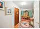 Warm foyer featuring a wooden front door and a view into the dining room at 51 Vienna Way, Douglasville, GA 30134