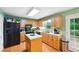 Spacious kitchen with custom cabinets, an island, and stainless steel appliances at 51 Vienna Way, Douglasville, GA 30134