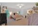 Bright bedroom with neutral carpet and a decorative black cabinet next to a window at 511 Etris Ct, Roswell, GA 30075