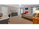 Large bedroom with a desk, bed, and natural light from a window at 511 Etris Ct, Roswell, GA 30075