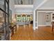Inviting foyer showcasing hardwood floors, high ceilings, and an open view to the living room at 511 Etris Ct, Roswell, GA 30075