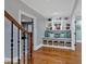 Hallway featuring a built-in bench with storage below and a bookcase above at 511 Etris Ct, Roswell, GA 30075