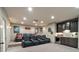 Home theater with reclining seats, a projector, and wet bar with custom cabinets at 511 Etris Ct, Roswell, GA 30075