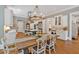 Spacious kitchen featuring custom cabinetry, stainless steel appliances, and a large island at 511 Etris Ct, Roswell, GA 30075