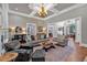 Cozy living room with coffered ceilings, hardwood floors, and comfortable seating at 511 Etris Ct, Roswell, GA 30075