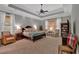 Bright main bedroom features neutral decor, large windows, and comfortable seating area at 511 Etris Ct, Roswell, GA 30075