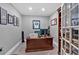 Well lit office area with built in shelving, a desk and sports memorabilia on the walls at 511 Etris Ct, Roswell, GA 30075