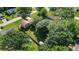 Aerial view of a home surrounded by trees and a backyard featuring a pool and shed at 618 Nw Summerville Dr, Lawrenceville, GA 30046
