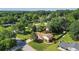 Aerial view of a home with a large front yard, mature trees, a backyard pool and storage shed at 618 Nw Summerville Dr, Lawrenceville, GA 30046