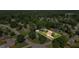 Aerial view of a neighborhood with mature trees surrounding well-maintained houses at 618 Nw Summerville Dr, Lawrenceville, GA 30046