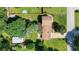 Aerial view of the home highlighting the lush backyard, storage shed, and proximity to the neighborhood at 618 Nw Summerville Dr, Lawrenceville, GA 30046