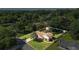 Aerial view of a home with a large front yard, driveway, mature trees and a backyard storage shed at 618 Nw Summerville Dr, Lawrenceville, GA 30046