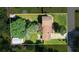 Aerial view of the home highlighting the lush backyard, storage shed, and proximity to the neighborhood at 618 Nw Summerville Dr, Lawrenceville, GA 30046