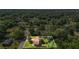 An aerial view showcases this charming single-Gathering home's spacious and well-maintained lawn and surrounding trees at 618 Nw Summerville Dr, Lawrenceville, GA 30046