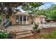 Cozy backyard patio with brick flooring, mature trees, and hammock at 618 Nw Summerville Dr, Lawrenceville, GA 30046