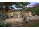 Picturesque backyard featuring a large brick patio, trees and a hammock at 618 Nw Summerville Dr, Lawrenceville, GA 30046