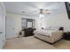 Comfortable bedroom features a large window and a ceiling fan for year-round comfort at 618 Nw Summerville Dr, Lawrenceville, GA 30046