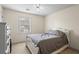The bedroom boasts a ceiling fan and a large window, perfect for study and relaxation at 618 Nw Summerville Dr, Lawrenceville, GA 30046