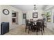 Inviting dining area with tiled floors, a round table with seating, and views to living area at 618 Nw Summerville Dr, Lawrenceville, GA 30046