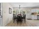 Cozy dining area with ample natural light, tiled floors, and seating for six, ideal for gatherings at 618 Nw Summerville Dr, Lawrenceville, GA 30046